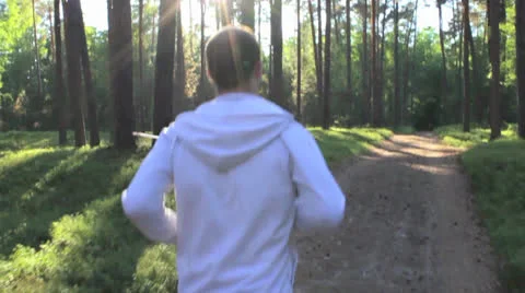 Runner in the Sunny Park Slow Motion Video stock 25420997