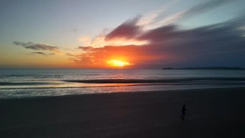Runner at sunrise on the beach Stock Footage 260225121