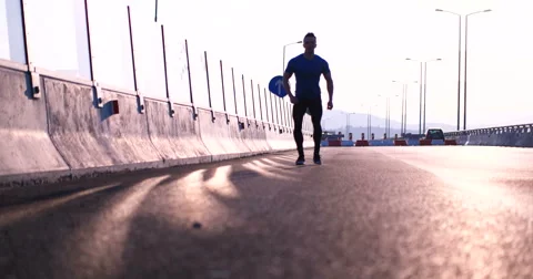 Runner takes a break on highway road Stock Footage 67230890