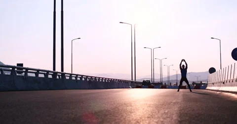 Runner takes a break on highway road Video stock 67238610