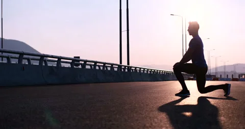 Runner takes a break on highway road Stock Footage 67241426