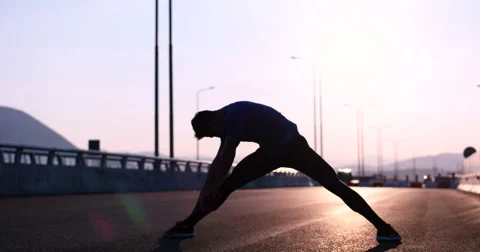 Runner takes a break on highway road Stock Footage 67247335