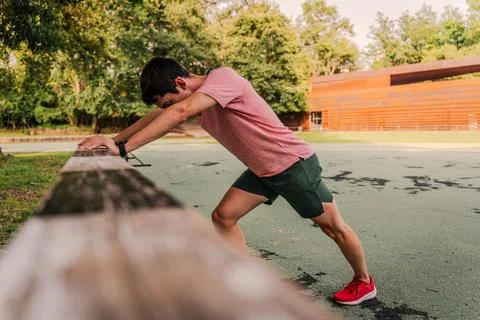 Runner taking a break during track and field training Stock Photos
