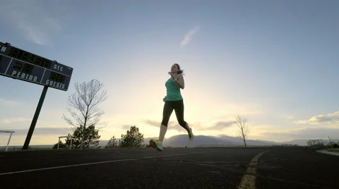 Runner On Track - Left to Right - Close Stock Footage 49067078