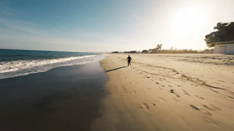 Runner Training On The Beach At Sunset Видео 272946765