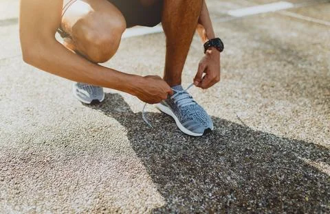 Runner trying running shoes getting ready for run. Healthy lifestyle Foto stock