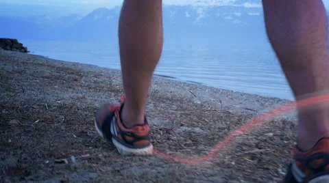 Runner walking by the lake - slow-motion Stock Footage 49075663