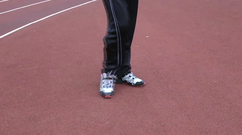 Runner warming up  legs flexing Stock Footage 55767767