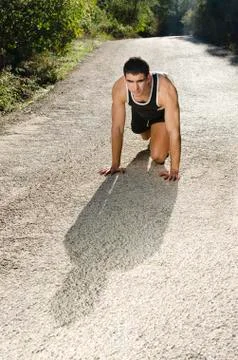Runner warming in the road Stock Photos
