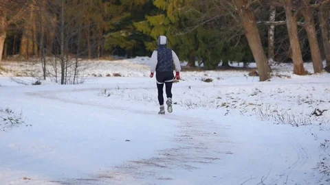 Runner in winter Park Video stock 71209067