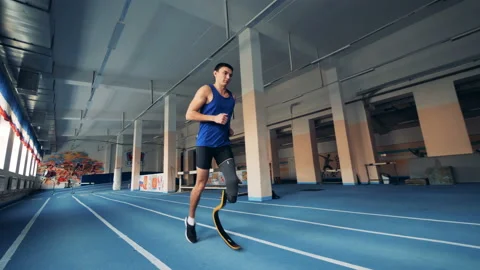 Runner workouts, wearing a prosthesis, close up. Stock Footage 99535427