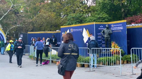 Runners accept awards and medals at a podium at the 50th New York City Marathon Video stock 166328762