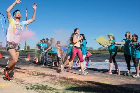Runners Are Covered With Colored Corn Starch At Color Run Foto stock