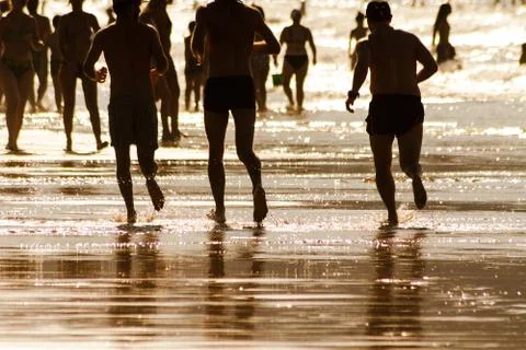 Runners in the beach Stock Photos