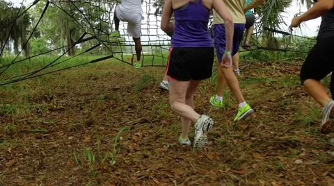 Runners Climbing Obstacle course net Stock Footage 40382358