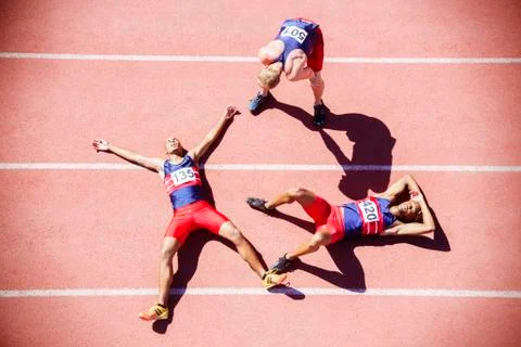Runners collapsing on track Stock Photos