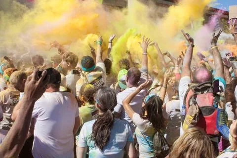 Runners Create Color Explosion With Multicolored Corn Starch Packets Stock Photos