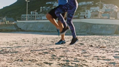 Runners doing speedwork exercise on beach Video stock 76520960
