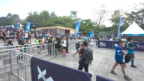 Runners entering waiting zone before start of UTMB ultra running Stock Footage 303870824