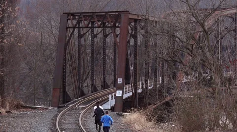 Runners Going Over Train Tracks Stock Footage 35517293