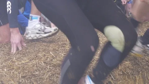 Runners jump over a hay bale Stock Footage 80672019