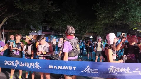 Runners Lined Up Behind Blue Start Tape Holding Phones, Back View, Lushan Stock-Footage 346701854