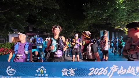 Runners Lined Behind Blue Timing Tape at Start, Man Waving, Lushan Stock Footage 346701858