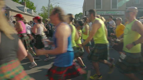 Runners pass Gore Street at the 2016 Perth Kilt Run Stock Footage 64738650