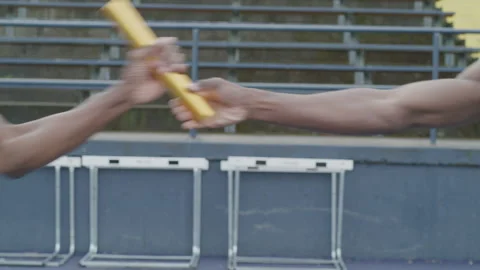 Runners Passing The Baton On Track Stock Footage 208742951