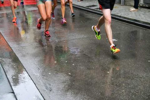 Runners rain 4 Stock Photos