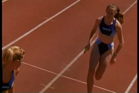 Runners in a relay race Stockbeeldmateriaal 2333704