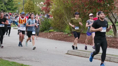 Runners Running During a Marathon - 4K Stock Footage 188869841