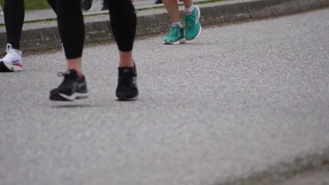 Runners Running In Slow Motion During a Marathon Stock Footage 188864689