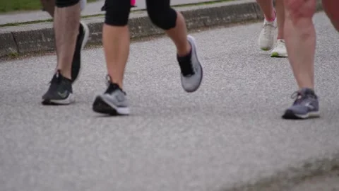 Runners Running in Slow Motion During a Marathon Race Stock Footage 188864773