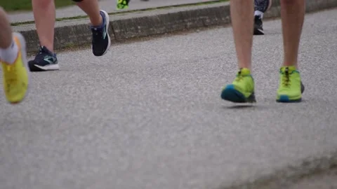 Runners Running In Slow Motion During a Marathon Stock Footage 188864815