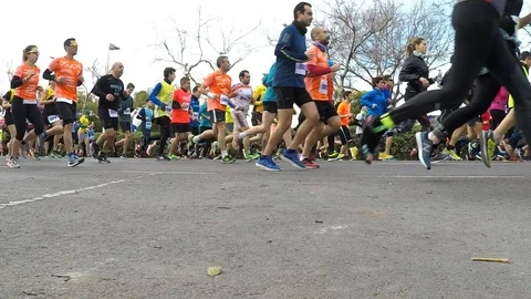 Runners in slow motion at the start of a Race Stock Footage 102095928