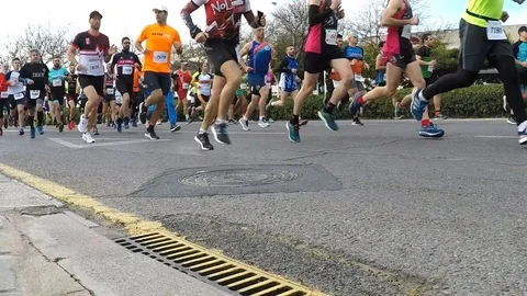 Runners at the Start of a Road Race Stock Footage 103802191