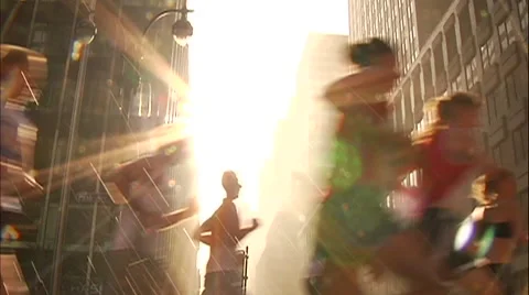 RUNNERS THROUGH SUN FLARE Video stock 51055988