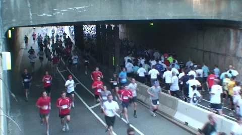 Runners under bridge out and back Video stock 51137514