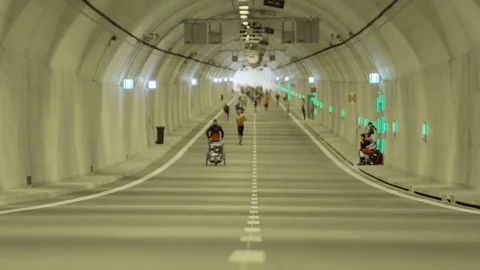 Runners in the underground tunnel Stock Footage 69855321