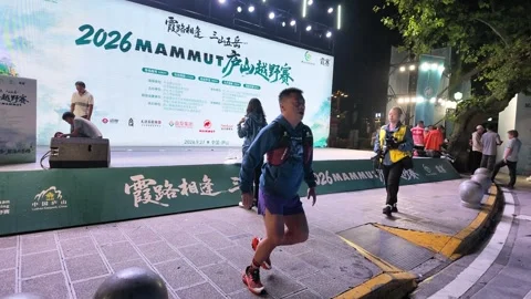 Runners Warming Up in Front of Large LED Stage Screen, Lushan Stock-Footage 346701420