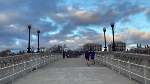 Running across a bridge over the Charles River Stock Footage 169686200