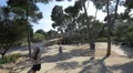 Running after big soap bubbles in Park Guell, Barcelona 4k or 4k+ Resolution