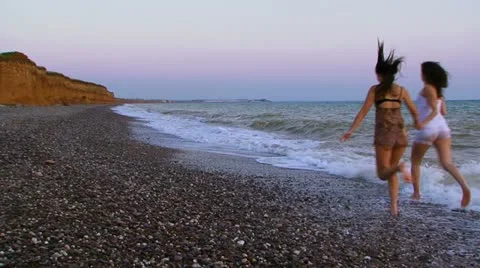 Running along the beach Stock Footage 21375123