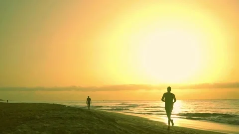 Running along the beach Stock Footage 246586434