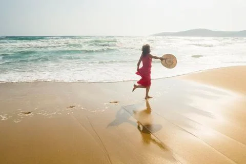Running along the beach Stock Photos