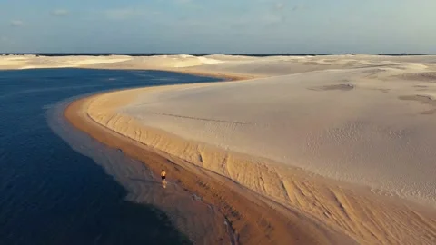 Running Along Sandy Beach of Beautiful Lagoon, Lencois Maranhenses, Brazil 스톡 동영상 169649207