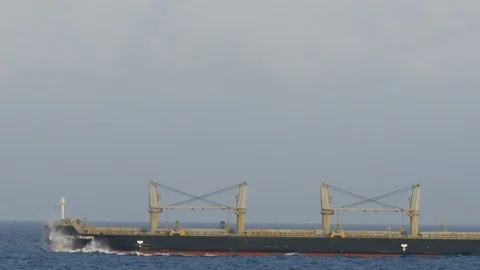 Running alongside bulk carrier ship in the Caribbean Stock Footage 109130793