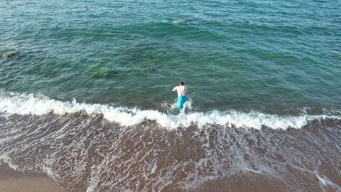 Running and jumping beach Stock Footage 214036710