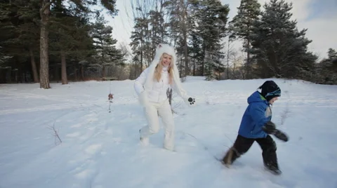 Running and playing in the snow. Stock Footage 49392248